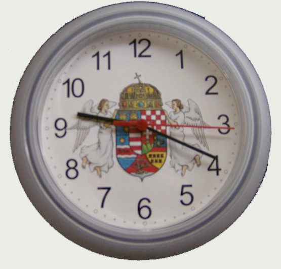 Műanyag falióra angyalos címerrel fehér színű (átmérő: 25 cm) Műanyag falióra angyalos címerrel fehér színű (átmérő: 25 cm)